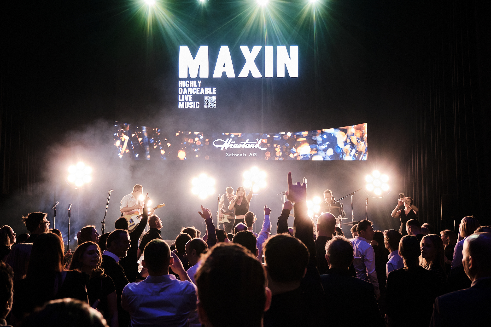 MAXiN at a corporate event